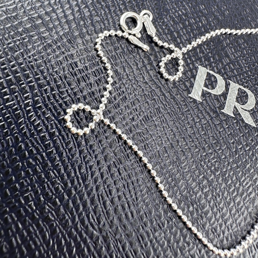 AUTHENTIC Prada charm on sterling silver chain. White and silver. - Picture 4 of 9